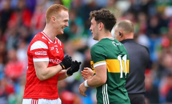 Louth’s Do<em></em>nal McKenny and Paudie Clifford of Kerry share a joke. Picture: ©INPHO/James Crombie